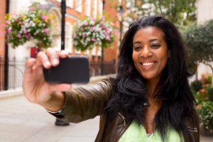 african american woman taking a selfie.